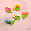 5 flat-back button embellishments pack with garden flowers, tulips, bluebells, daisies, primrose, yellow begonias