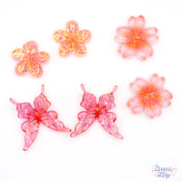 Get ready for the Cherry Blossom festival with this adorable set of bold pink embellishments. Each pack includes flowers and butterflies in complementary hues of pink. Perfect for Springtime crafting, each embellishment is a flat back resin component ideal for attaching to any craft surface. Largest piece in mix measures approx. 25mm x 25mm x 6mm. Smallest piece in pack measures approx. 17.5mm x 17.5mm x 6.5mmm.